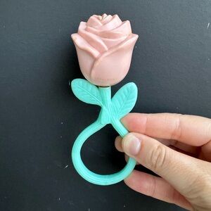 Vintage pink rose Plakie rattle from the 1950s